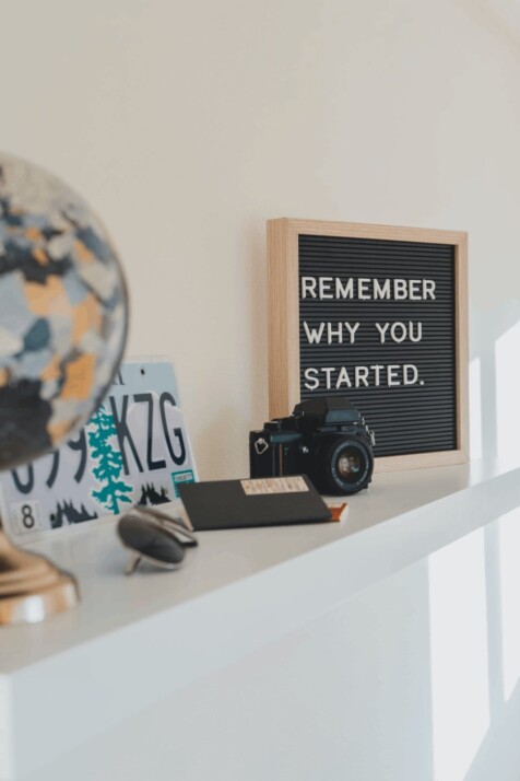 A small black board that says 'Remember why you started'