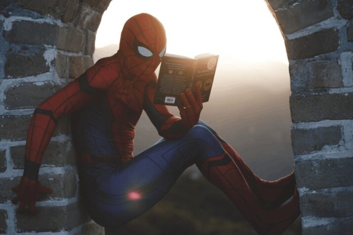 Spider-Man using the best strategy for him to practice his reading to improve.