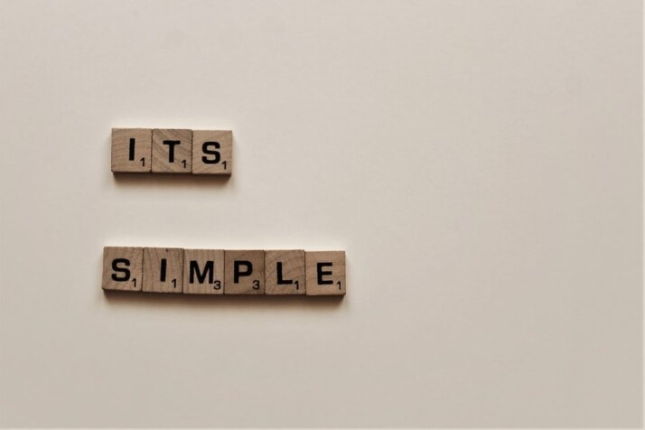 brown wooden scrabble tiles with the words ITS SIMPLE