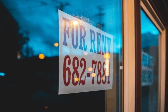 A red and blue For Rent neon light signage