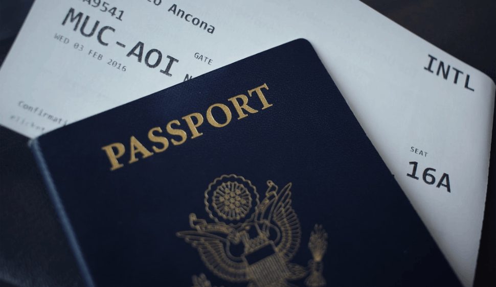 A passport booklet on top of a white paper