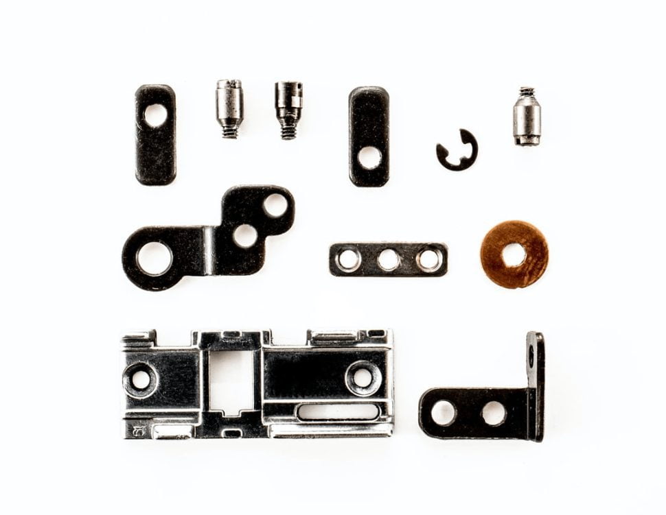 a disassembled camera showing all the brackets and bolts.