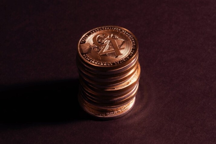 A pile of coins appearing on a red background