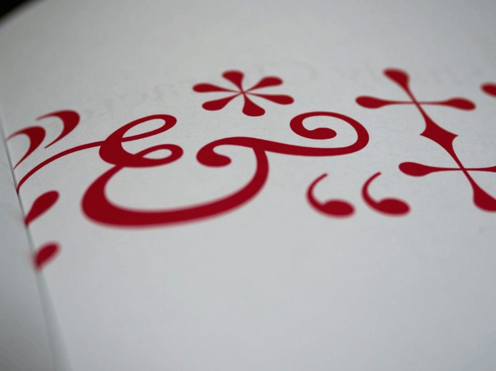 red and white symbols for punctuation marks on white paper.