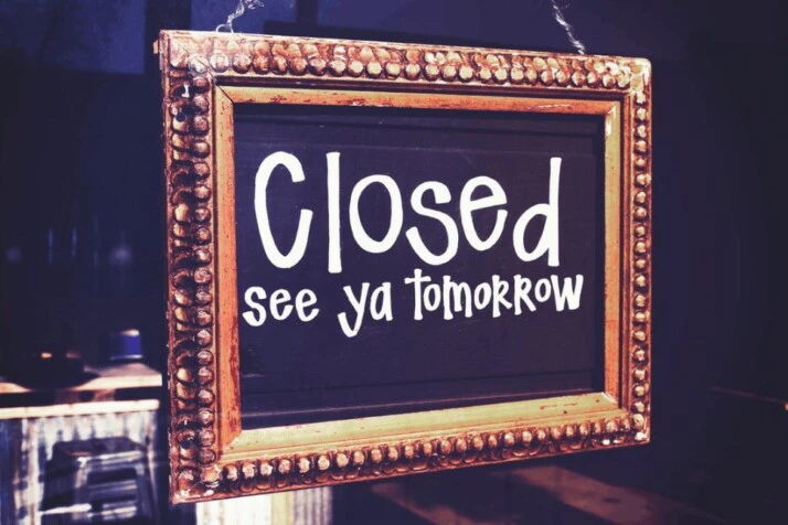 Closed see ya tomorrow signage in white on frame
