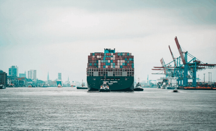 a shipping container named tampa triumph on its way to the docks.