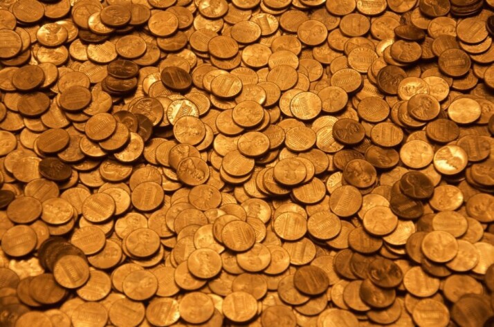A collection of golden coins scattered across the photo.