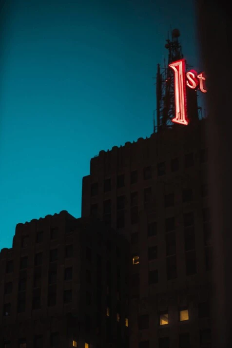 red and white led signage showing the ordinal number first