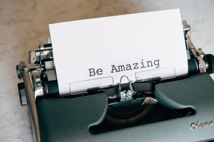 Be Amazing printed on a white printer paper on black typewriter