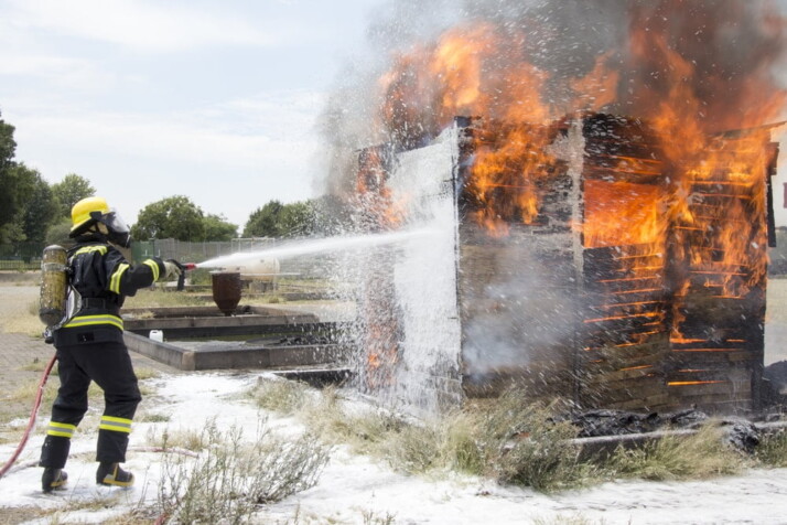 A test that involves a fireman extinguishing a fire.