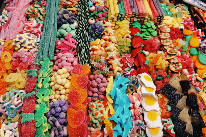 Loads of colorful candies carefully sorted by their types.