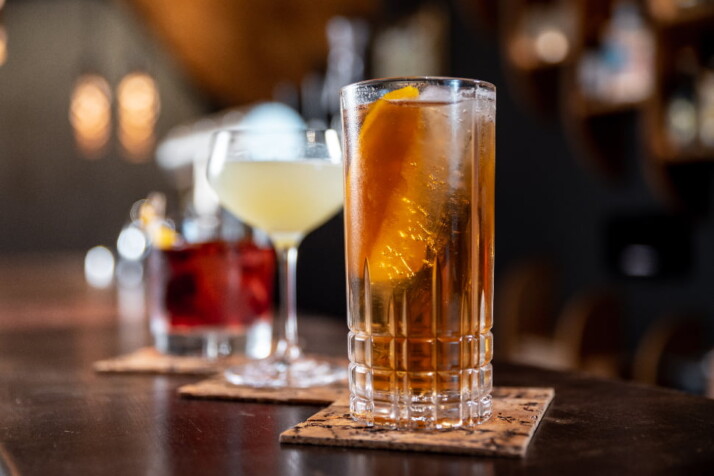 Three different types of drinks arranged in a single line.