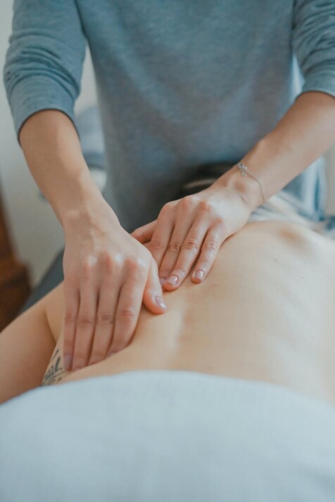 Close-up image of a back massage with the masseuse using their two hands.