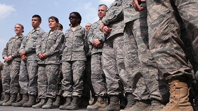 military men and women dressed in khaki and boot