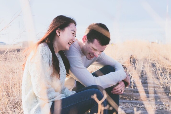 A photo of man and woman laughing during daytime
