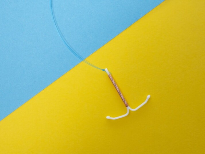 A picture of a hook with a blue and yellow background.