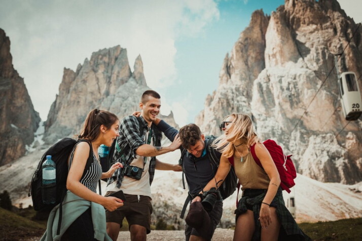 low-angle photography of two men playing beside two women