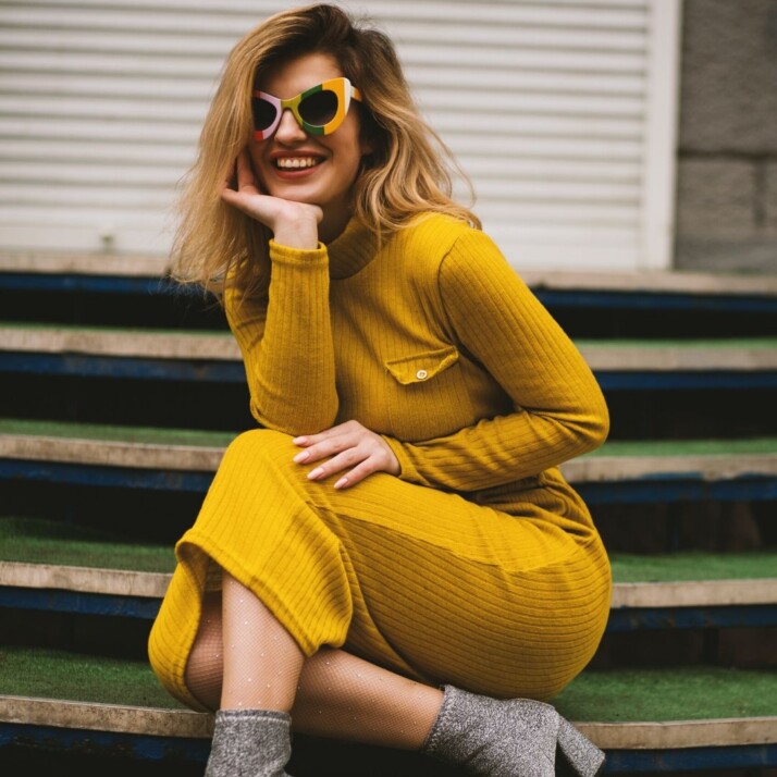 young lady wearing yellow gown, grey shoes and brown hair