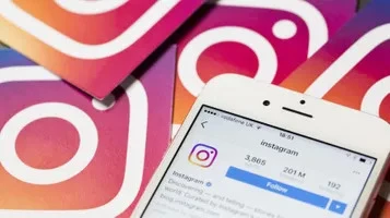 Instagram profile with 201M followers displayed on white Iphone