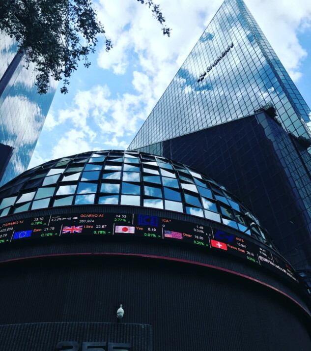 Photo of the stock market building displaying currency and asset prices.