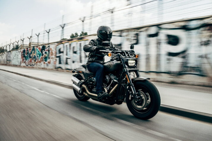 A bike lover with a helmet on riding and speeding on the road