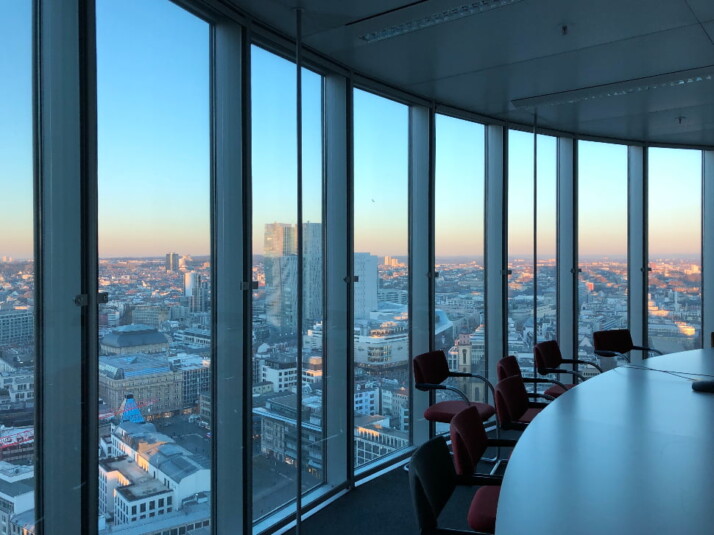 skyline of a major city, photographed from a meeting hall.