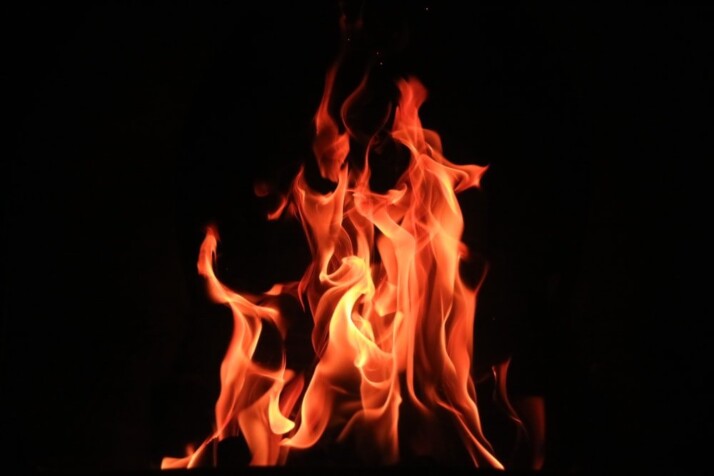 A picture of flames in front of a black background.