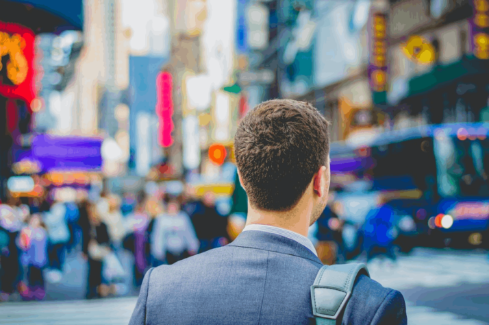 shallow focus photography of man in suit jacket's back