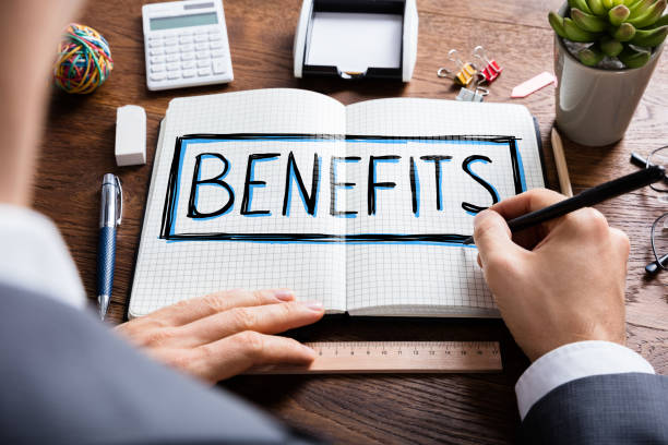 man wearing suit using pen to draw social security benefits 