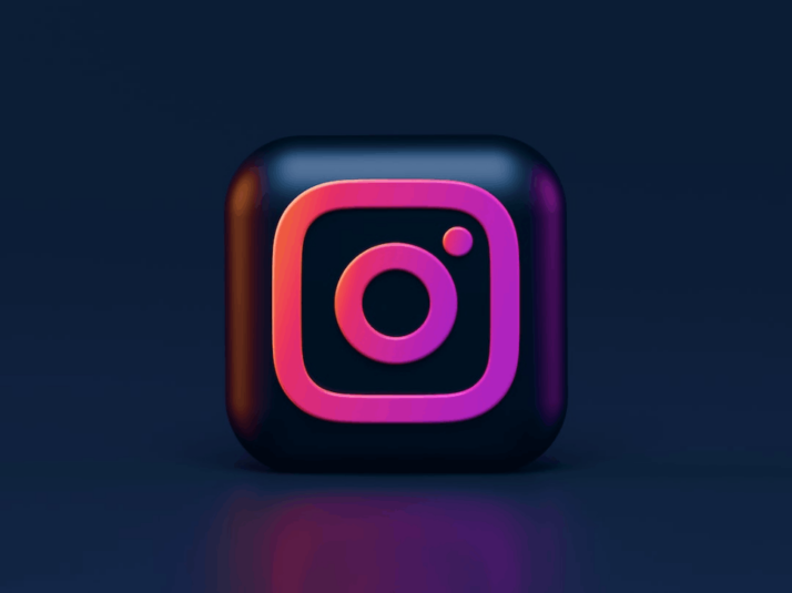 a 3d rendering of the Instagram logo against a black wall.