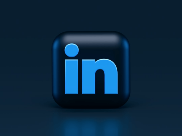 A sky blue and black logo for LinkedIn on a blue-black background. 