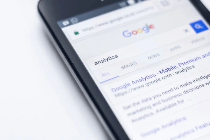 A smartphone showing Google search of the term Analytics