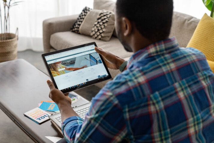 A guy looking at the LinkedIn Sales Navigator page on an iPad.