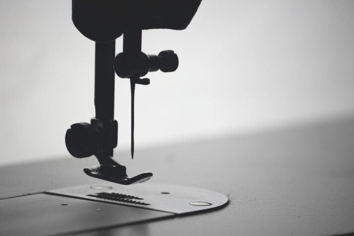 macro photography of sewing needle