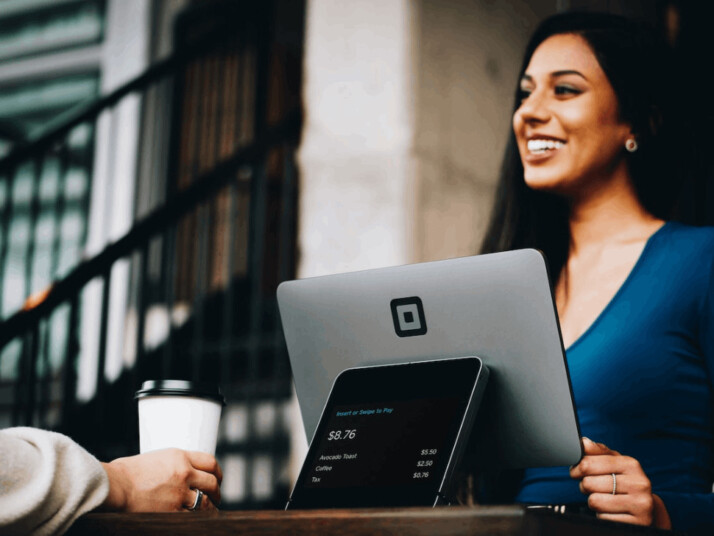 A gray computer monitor and a customer service representative