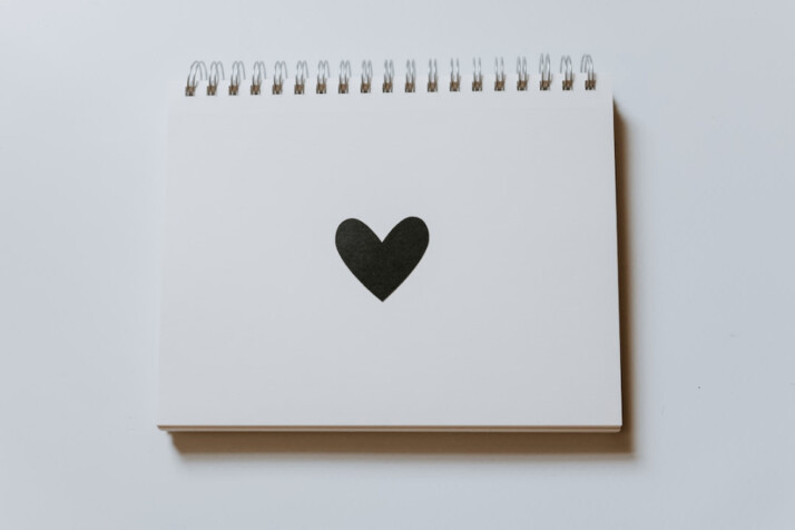 black heart drawn on notebook