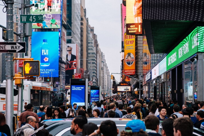 A busy day at Times Square New York with tons of people on the streets.