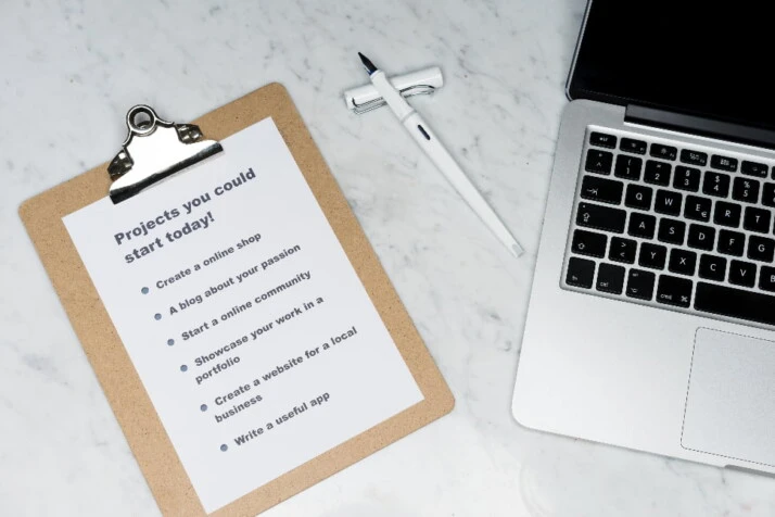 A list of projects you could start today placed on a clipboard.