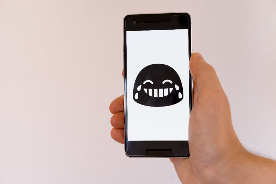 An emoji that's laughing with tears streaming from its eyes.