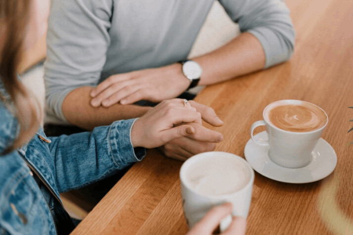 man and woman holding hands