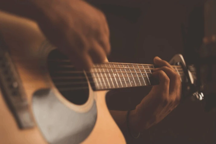 person playing guitar