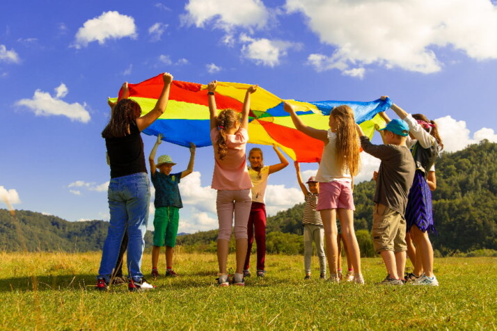 An image of children camp entertainment activity on a  field