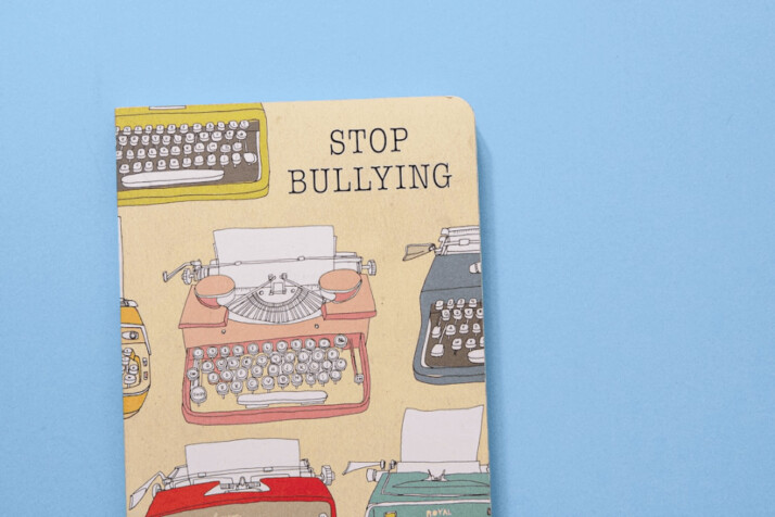 Illustrations on a book with the text Stop Bullying