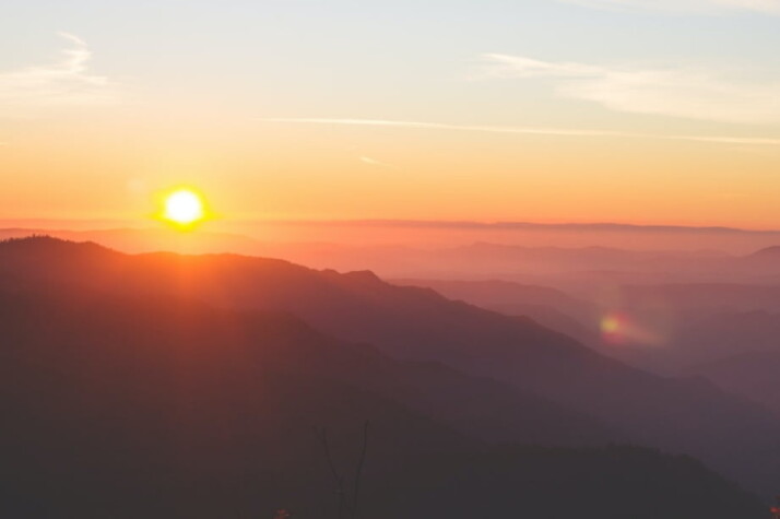 The sunset painting the sky in an orange and pink hue.