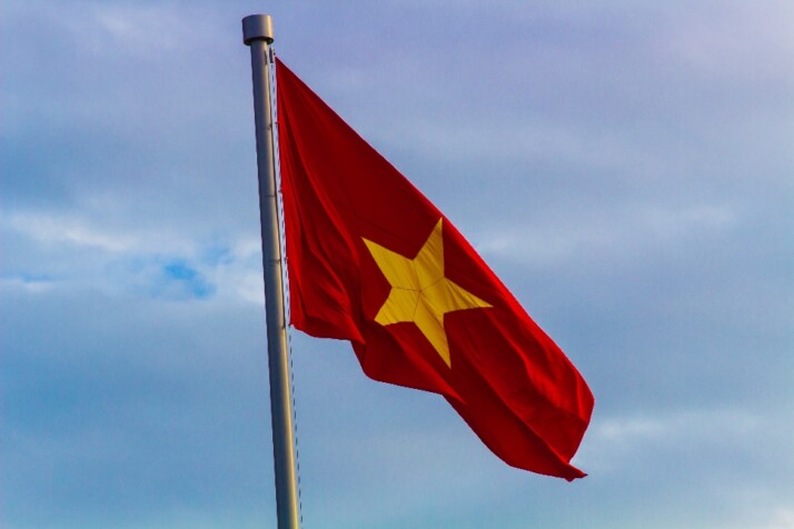 The Vietnamese flag on top of a flag pole
