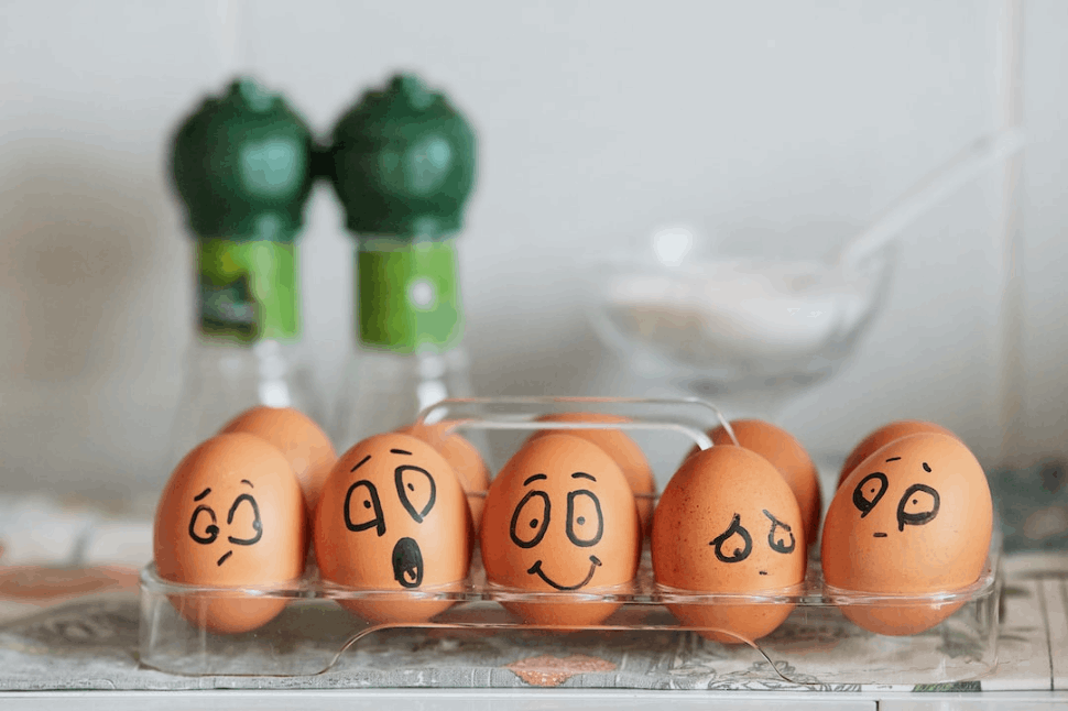 brown eggs with different faces drawn on it to show emotions