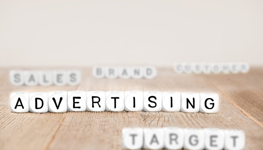 advertising, target, sales and brand writing on brown surface