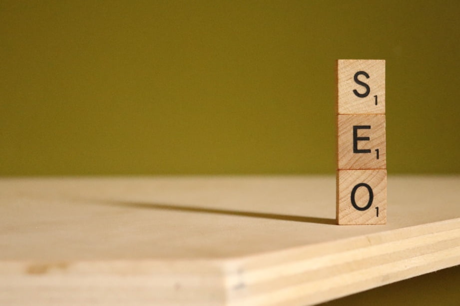 Scrabble tiles S, E, and O stacked on top of each other.