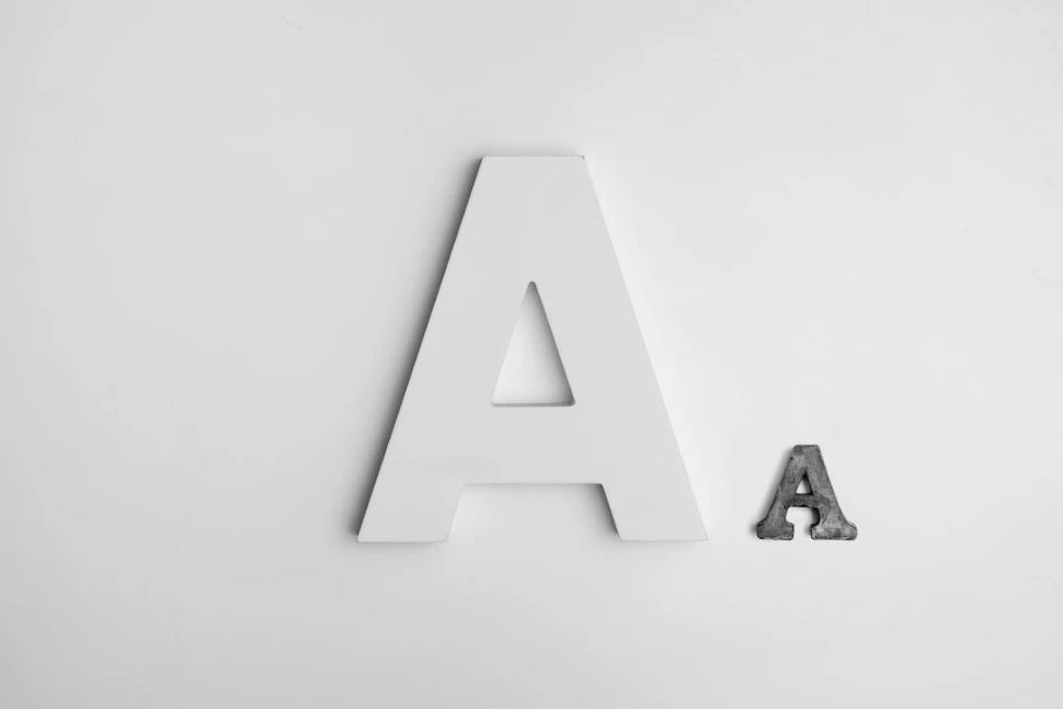 A decorative lettering white and gray A on a white background.