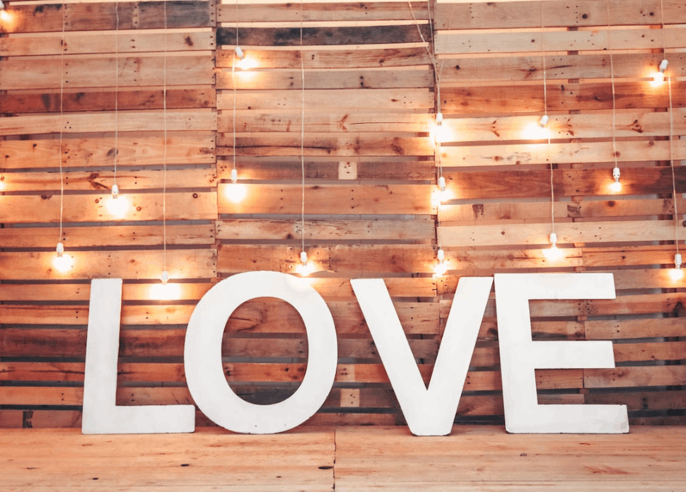 white love free standing letter with shining light bulbs